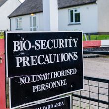sign reading "bio-security precautions, no unauthorized personnel"