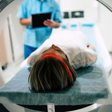 woman entering MRI machine on platform